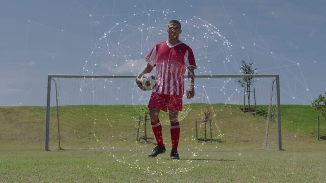 Male soccer player placing right foot on ball, practicing animated ring aligning with body and goal