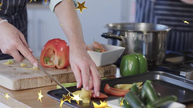 Cook starting slicing pepper on board, filling tray or bowl for baking while gold stars overlaying