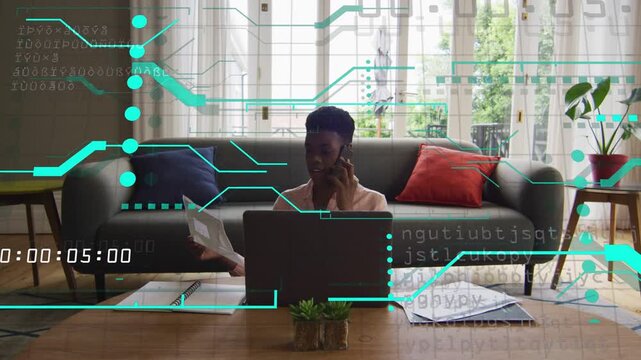 Woman answering phone while sorting business papers and using laptop, teal overlay showing timecode