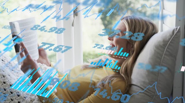 Woman reading at window, opening book leisurely, smiling while blue IT charts drifting across cover