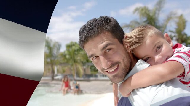 Dad carrying child on back pool child hugging starting dad smiling flag framing left for travel