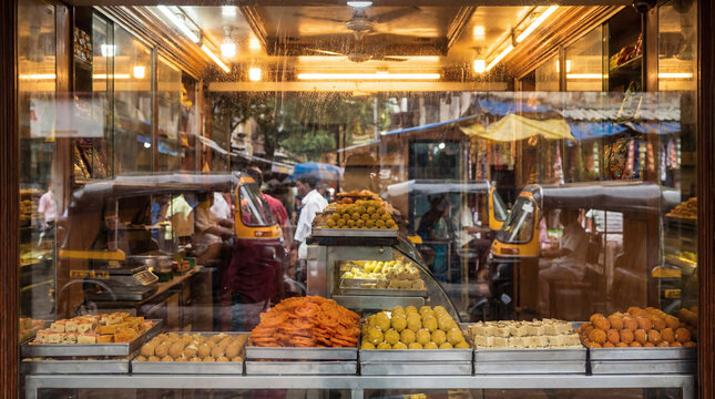 Traditional Indian Sweet Shop Window Display with Mithai and Jalebi