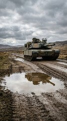 Fototapeta premium Military battle tank driving on mud road. Heavy armored combat vehicle on training terrain. National defense and security power. Strategic maneuver during field tactical exercises.