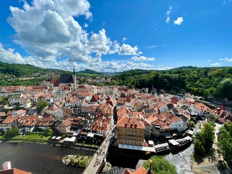 Aerial panoramic view of the historic town of Cesky Krumlov with red roofs and river