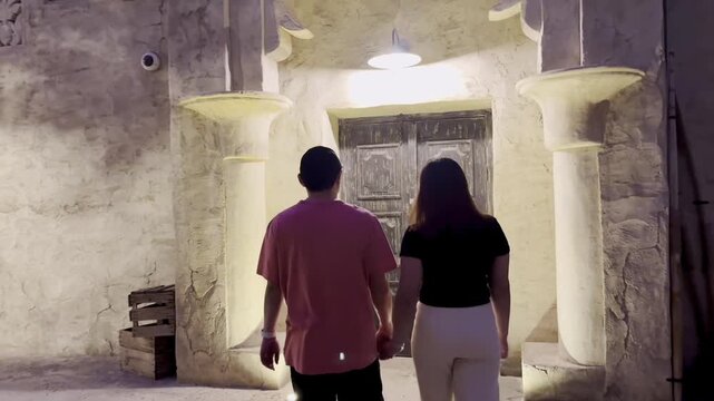 A Filipino couple explores Old Dubai&rsquo;s vibrant streets, enjoying heritage souqs, warm lights, and the city&rsquo;s timeless charm together.