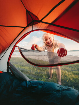 Child girl peeking into tent entrance camping gear summer vacations family fun travel outdoor, kid happy smiling hiking healthy lifestyle adventure holidays tour candid emotions