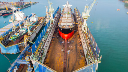 A full service shipyard and modern shipbuilding facility Dry dock with Cargo Ship maintenance or repair at floating dock © Photo Gallery