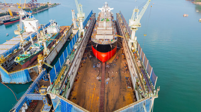 A full service shipyard and modern shipbuilding facility Dry dock with Cargo Ship maintenance or repair at floating dock