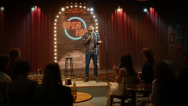 Edited Montage. Comedian Opens a Stand-up Set Onstage, Delivering Jokes Into a Microphone Seated Audience Applauds and Laughs at the Live Comedy Performance. Beginning of the Funny Show at the Bar