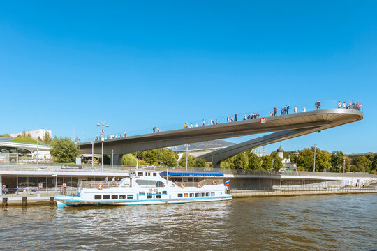 Moscow, Russia - September 11, 2025: The Floating bridge and the Zaryadye boat station. Moscow river scape.