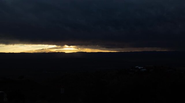 Spectacular Rainy Sunrise with Virga over Horizon in the High Desert