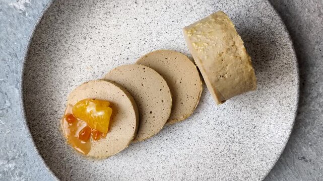 Foie gras, sliced chicken liver with fruit jam for French toast. Foie gras as a food background for your design