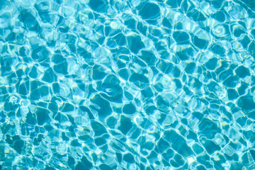 Fototapeta premium Reflections on the water in a clear pool.