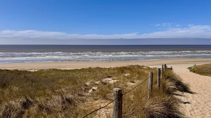 Keuken achterwand Noordzee Dunes Holland, beach entrance without people along the coast of the North Sea outdoor at daytime with blue sky during springtime season in Noordwijk aan Zee in The Netherlands with space for text.  © Sanne