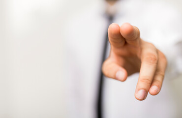 Obraz premium Close-up of hand pointing forward, offering a decision, choice or direction. Suitable for business,