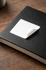 Fototapeta premium Peeling Sticker on Black Notebook Cover