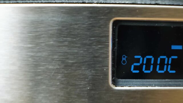 Close-up of Digital Oven Display Showing 200 Degrees Celsius with Blinking Icon
