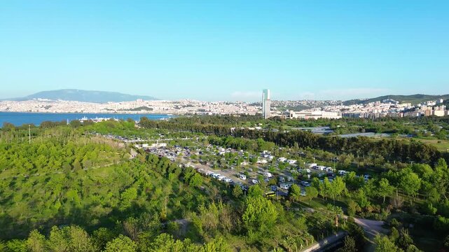 Stunning aerial views of a lush coastal landscape with urban backdrop