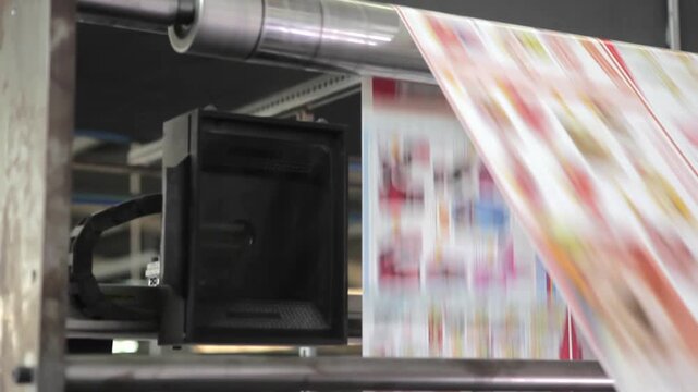 Close-up of ink details on newspaper during printing, highlighting texture, precision, and quality of industrial print production.