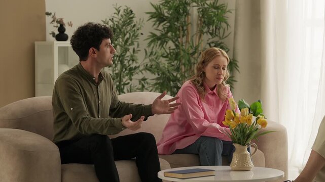 Annoyed man complaining about his spouse to a marriage counselor during session