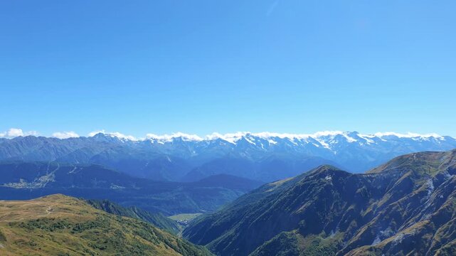Mountain hiking landscape with snow-capped mountains in Mestia, Svaneti region in Georgia.