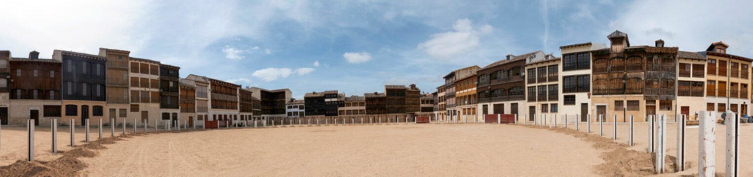 Panoramic view of the Plaza del Coso in Pe&ntilde;afiel, Spain. A traditional medieval town square surrounded by historic houses with wooden balconies, famous for its cultural heritage and bullfighting.