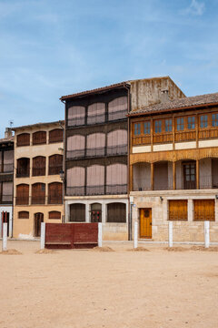 View of the unique Plaza del Coso in Pe&ntilde;afiel, Spain. A traditional medieval town square surrounded by historic houses with wooden balconies, famous for its cultural heritage and bullfighting.