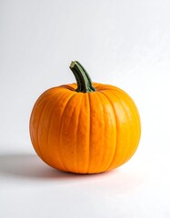 Obraz premium Single Small Orange Pumpkin on White Surface.