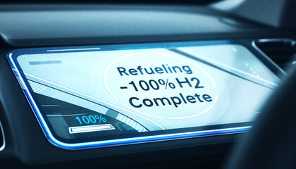 Obraz premium Modern car interior dashboard display showing completed hydrogen refueling with 100% H2 status on a futuristic infotainment screen