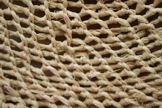 Natural raffia open weave texture background