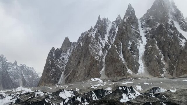 Traversing mountain terrain with glacial moraines and crevasses captured at 16000 Feet ASL, cinematic shot