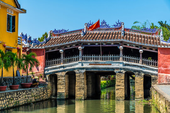 A view towards the Japanese Covered Bridge in Hoi An, Vietnam on a bright sunny day