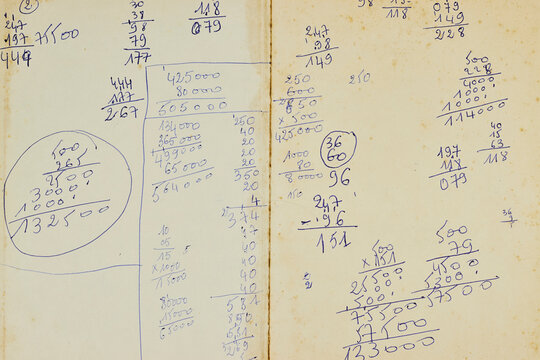 Handwritten Calculations and Vintage Accounting Notes on Aged Paper With Blue Ink Scribbles