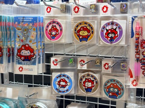 andCOFFEE Maison Kayser display featuring Expo 2025 Osaka Kansai official character merchandise including Myaku-Myaku stickers, keychains, and stationery - Hyogo, Japan, April 24, 2026