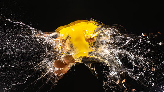 Egg exploding at high speed creating a messy splash