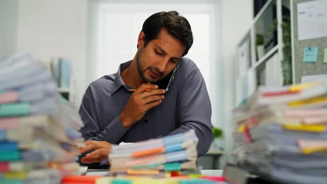 Latin manager alone in office, overworked and frustrated, buried under documents and project demands.

