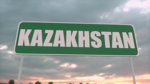Green Kazakhstan Road Sign Against Cloudy Sunset Sky