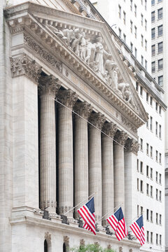 The neoclassical facade of the New York Stock Exchange on Wall Street in Lower Manhattan.