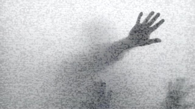 Figure Reaches Out Through Frost. Silhouetted Palms Contact Cold Glass As Figure Seeks Escape . Media