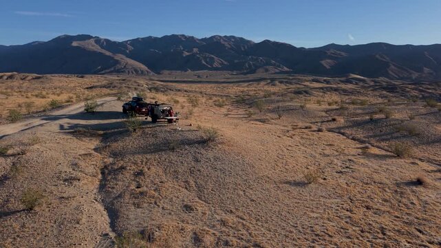 View the teardrop camper and SUV on the trail in Anza Borego Desert. This trip shows the landscape and natural beauty of the area.