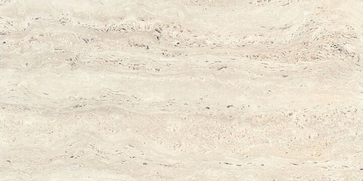 A close-up view of a sandy surface with visible grains and texture