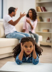 Obraz premium Sad child covering ears during parents argument.