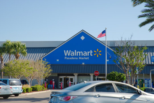Walmart Pasadena Market Storefront Exterior With American Flag and Parking Lot Activity Editorial Use Only South Pasadena, FL USA, April 28, 2026. Cars in the parking lot, an American flag flying, sho