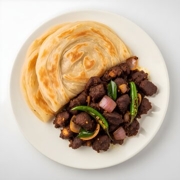 Kerala style black bean curry with malabar parotta on a white plate