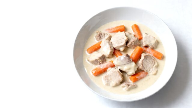 creamy french blanquette de veau stew in white bowl closeup minimalist food photography