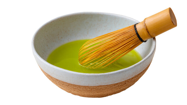 Matcha green tea liquid in ceramic bowl with bambo whisk for detox superfood, isolated cutout
