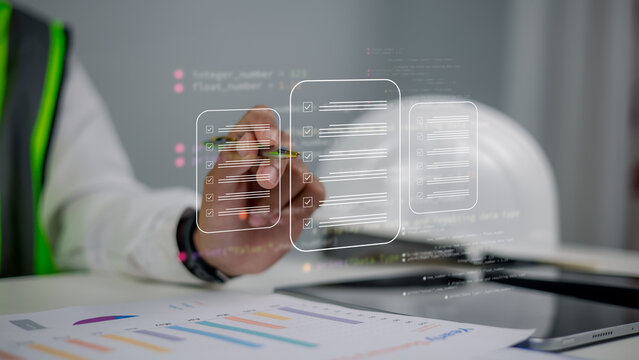 Engineer using virtual digital checklist for project inspection,Industrial data management and coding for building automation,Smart construction quality control with digital interface display.