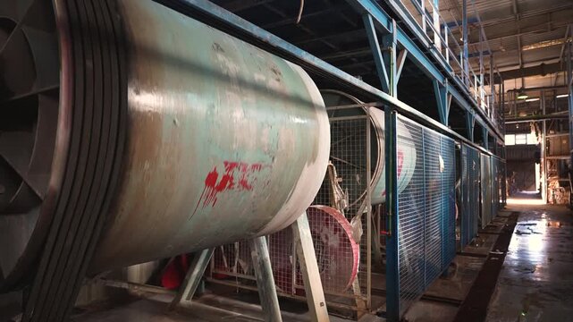 Ceramic factory rotary kiln rotating &ndash; industrial production line tracking shot