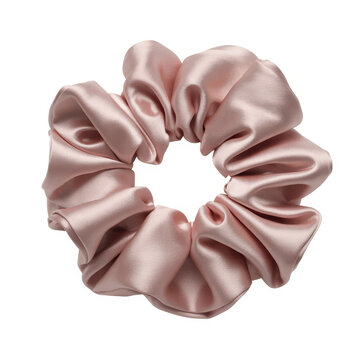 Soft pale pink satin fabric hair scrunchie isolated on a plain white background
