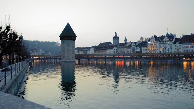 Shot of historic Chapel Bridge and Wasserturm tower in Lucerne, Switzerland
